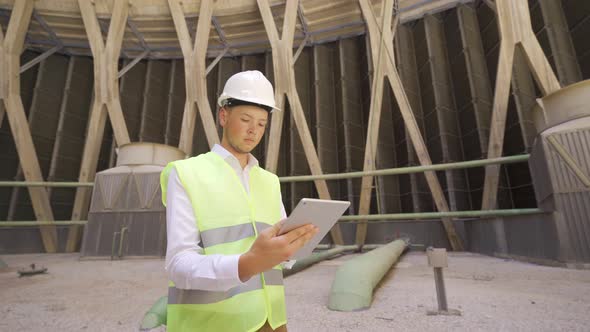 Engineer working with his tablet.