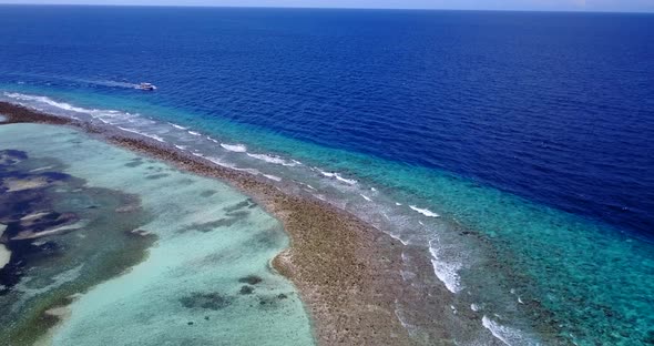 Luxury overhead abstract view of a white sandy paradise beach and aqua blue water background