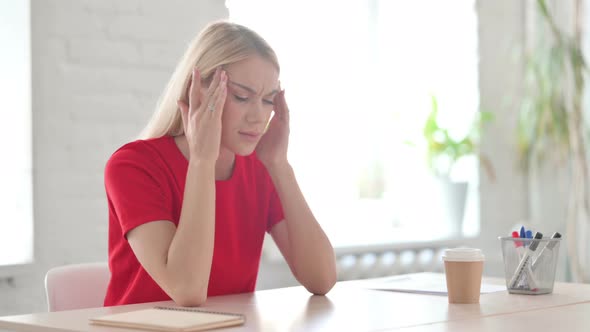 Young Blonde Woman having Headache with Emotional Stress