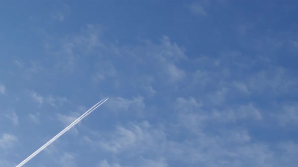 Trace of an Airplane Flying High in the Sky