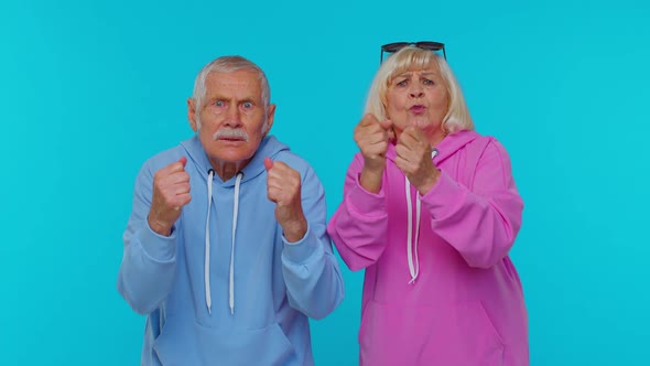 Displeased Senior Old Couple Man Woman Grandparents Gesturing Hands with Irritation and Displeasure