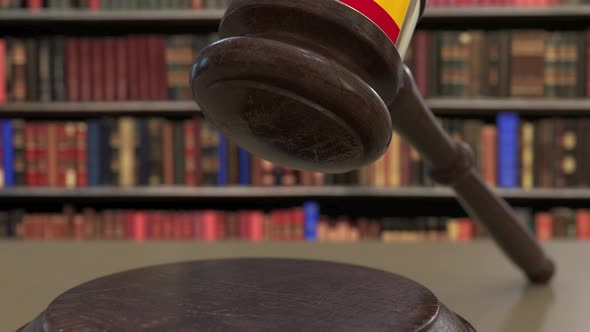 Flag of Spain on Falling Judges Gavel in Court