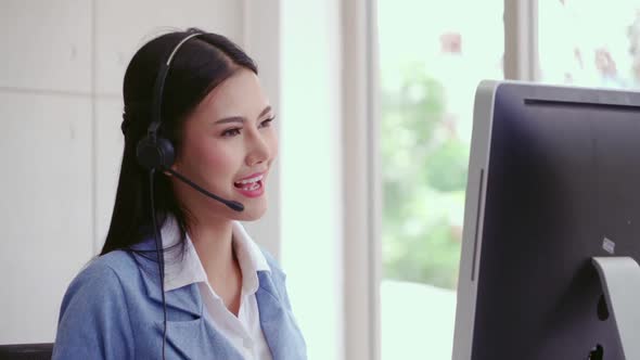 Customer Support Agent or Call Center with Headset Talking to Customer on Phone