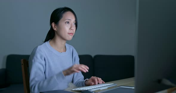 Woman work on computer at night