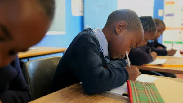 Schoolboy studying in the classroom at school 4k