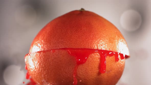 Half Grapefruit Falling and Splashing on White Kitchen Background