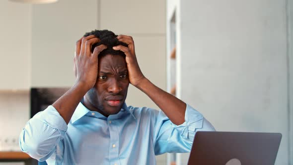 Emotional young student in shirt at work