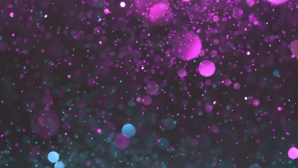 Super Slow Motion Shot of Neon Glitter Background at 1000Fps.