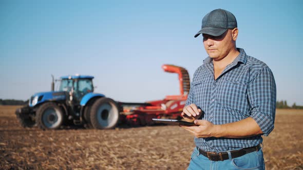 Farmer Using Digital Tablet
