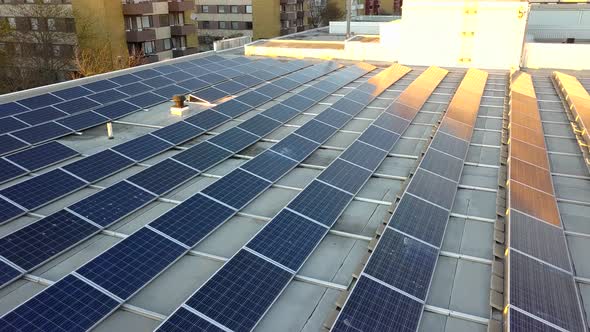 Solar power panels on top of residential building roof for producing of green ecological electricity