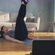 Lady in Sportswear Does Crunches and Leg Lifts Near Laptop - VideoHive Item for Sale