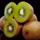 Kiwi fruit rotating on a black background in 4K. Close up of fresh and tasty kiwi - VideoHive Item for Sale