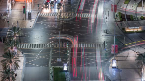 View of Intersection with Many Transports in Traffic Night Timelapse Aerial