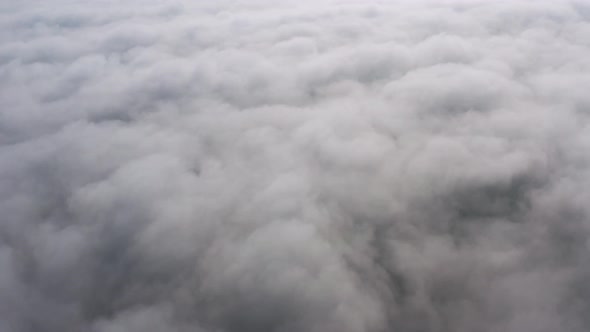 Aerial View of the Sky and Clouds That the Camera Flies Into