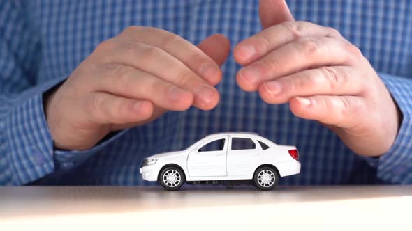 Male Hands Protect Car