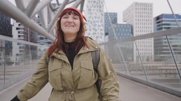 Hipster Woman Spinning in the Center of a City