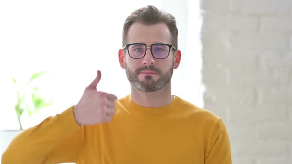 Portrait of Man Showing Thumbs Up Sign