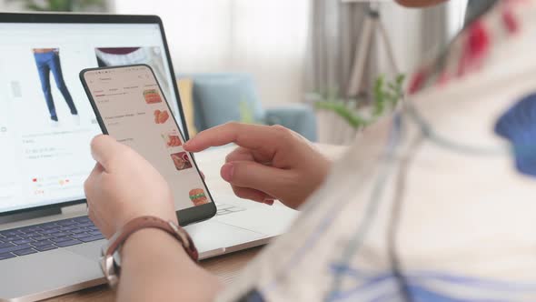 Close Up Man Using Smartphone And Laptop Computer Order Food And Clothes Online, Online Shopping