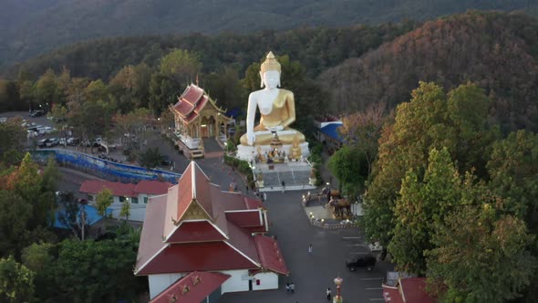Aerial View of Wat Phrathat Doi Kham Buddha Pagoda and Golden Chedi in Chiang Mai Thailand