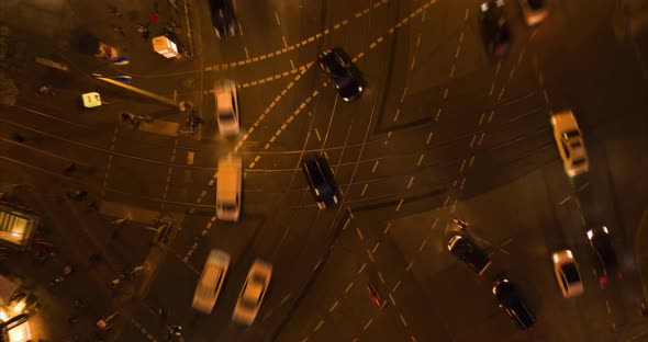 AERIAL: Beautiful Aerial Drone Time Lapse of Busy Intersection at Night in Berlin, Germany with City