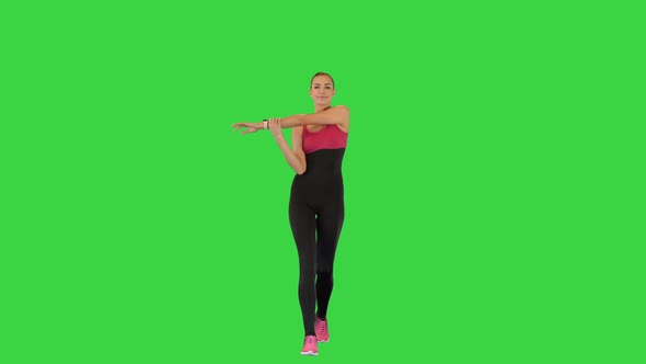 Female Athlete Warming Up While Walking on a Green Screen Chroma Key