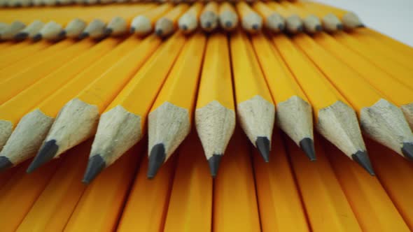 Yellow Pencils Lie on Top of Each Other in Even Rows