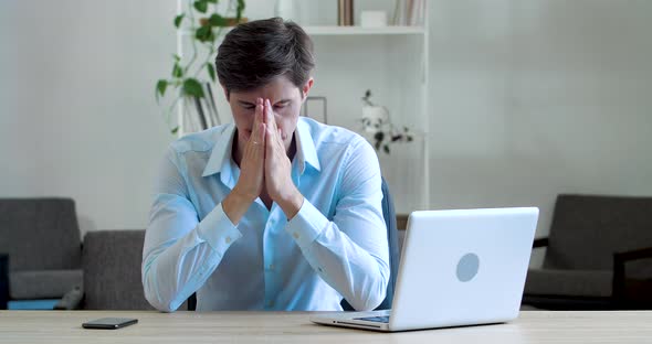 Shocked Frustrated Caucasian Millennial Business Man Student Feel Stressed Look at Computer Screen