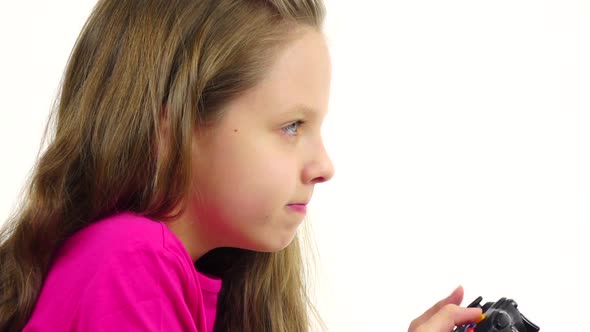 Girl Playing Video Game in Slow Motion. White Background, Closeup