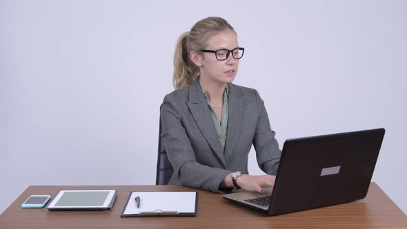 Young Beautiful Blonde Businesswoman Interviewing at Work