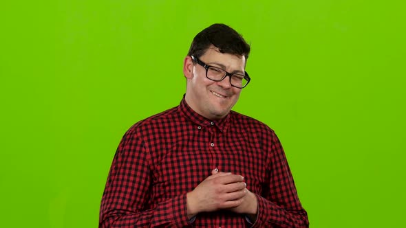 Male Actor Smiles, Showing Them Different Grimaces and Language. Green Screen