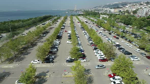 Parking Lot And Aerial View of Many Parked Cars