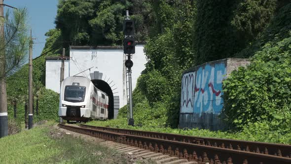 Batumi, Georgia - May 23 2021: Georgian railway high speed train moving over the camera