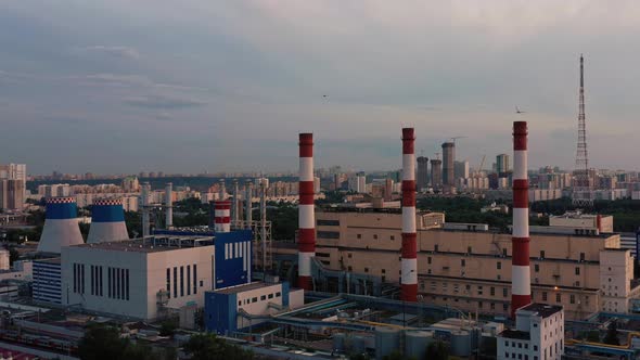 Aerial Drone Zoom Out Shoot of White Red Tubes of Manufacturing Industrial Plant