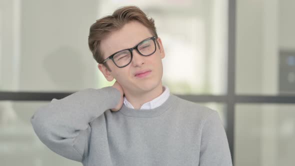 Portrait of Young Man Having Neck Pain