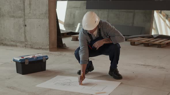 Builder Correcting Blueprints on Construction Object