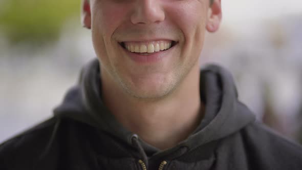 Cropped Shot of Cheerful Young Man Laughing