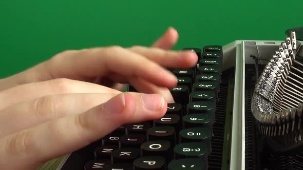 The girl is typing on a retro typewriter on a green background