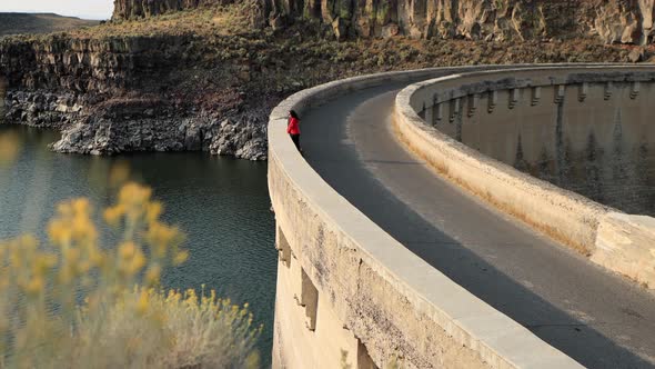 Asian woman hiking near the Salmon Falls Dam in Southern Idaho