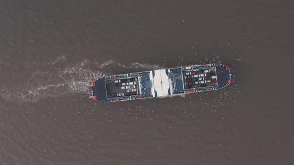 High top down drone shot of car ferry turning India