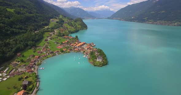 Aerial travel drone view of Iseltwald, Lake Brienz, Switzerland.