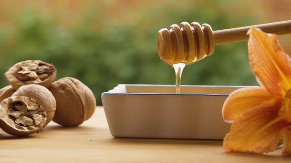 Honey pouring from honey spoon