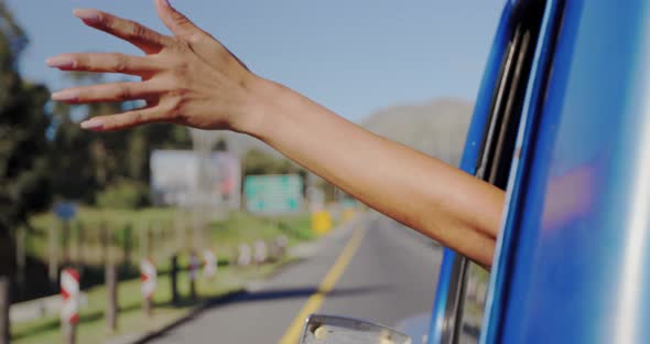 Young woman on a road trip in pick-up truck