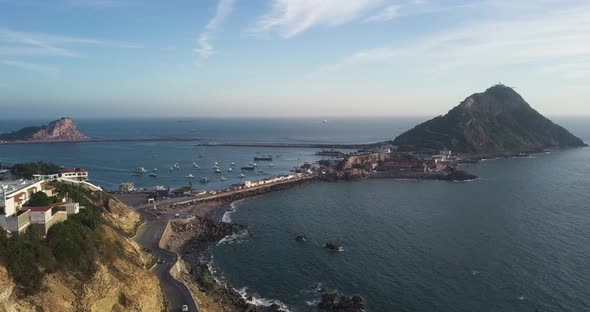 Beautiful aerial scenic of Mexican coastal, touristic spot of lighthouse on hill connected by windin