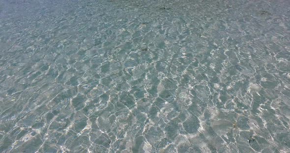 Luxury birds eye abstract view of a white paradise beach and blue sea background in hi res 4K