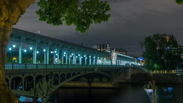 View of Pont De BirHakeim Night Timelapse  a Bridge That Crosses the Seine River