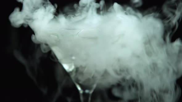 Closeup of Drink in Glass of Martinis with the Effect of Dry Ice