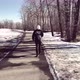 Girl Walking In Park On A Winter Day - VideoHive Item for Sale