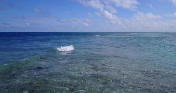 Beautiful fly over abstract view of a summer white paradise sand beach and blue ocean background