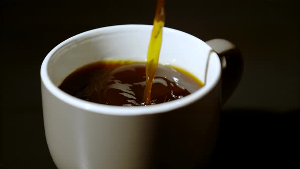 Pouring coffee into mug, Ultra Slow Motion