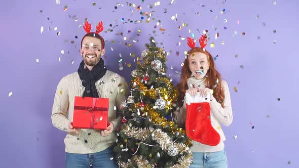 Joyful Happy Young People Standing Under Falling Confetti